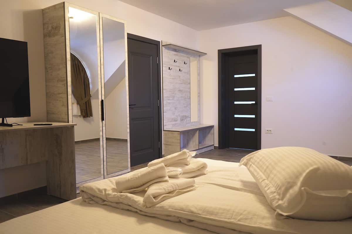 Deluxe Quadruple Room, Mountain View | Desk, laptop workspace, iron/ironing board, free WiFi