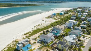 A coastal residential area with houses near a beach and a marina. - A Pirate's Paradise (St. Augustine)