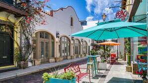 A quaint street with a café named "Peace Pie" offering sandwiches. - Little Blue Cottage (St. Augustine)