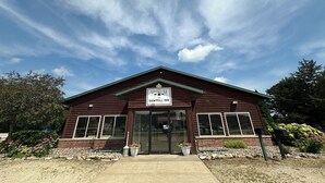 A two-story building with a sign reading "The Sawmill Inn." - The Sawmill Inn (Houston)