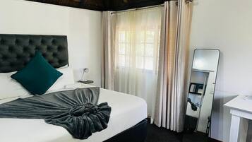 Superior Room | Desk, laptop workspace, blackout drapes, iron/ironing board