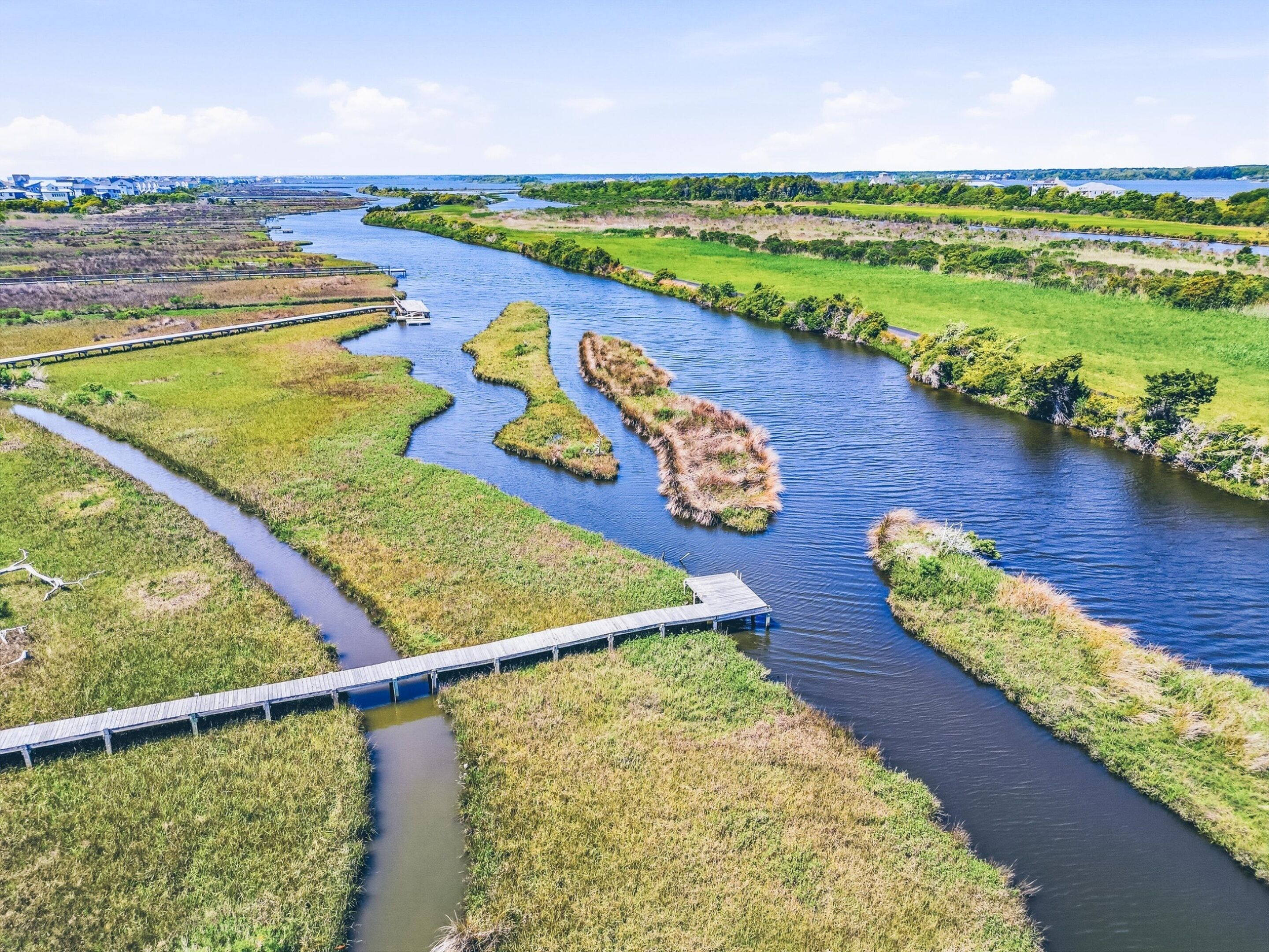 A river with islands and a bridge.
