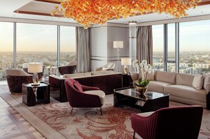Presidential Suite, 1 Bedroom | Living room | 65-inch flat-screen TV with digital channels