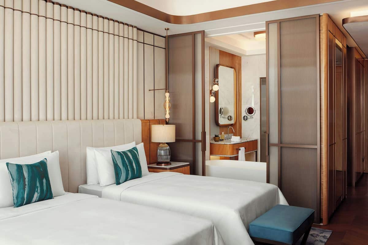 Premium bedding, down comforters, Tempur-Pedic beds, minibar