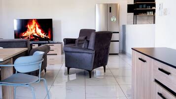 Deluxe Apartment, 4 Bedrooms, City View | Living area