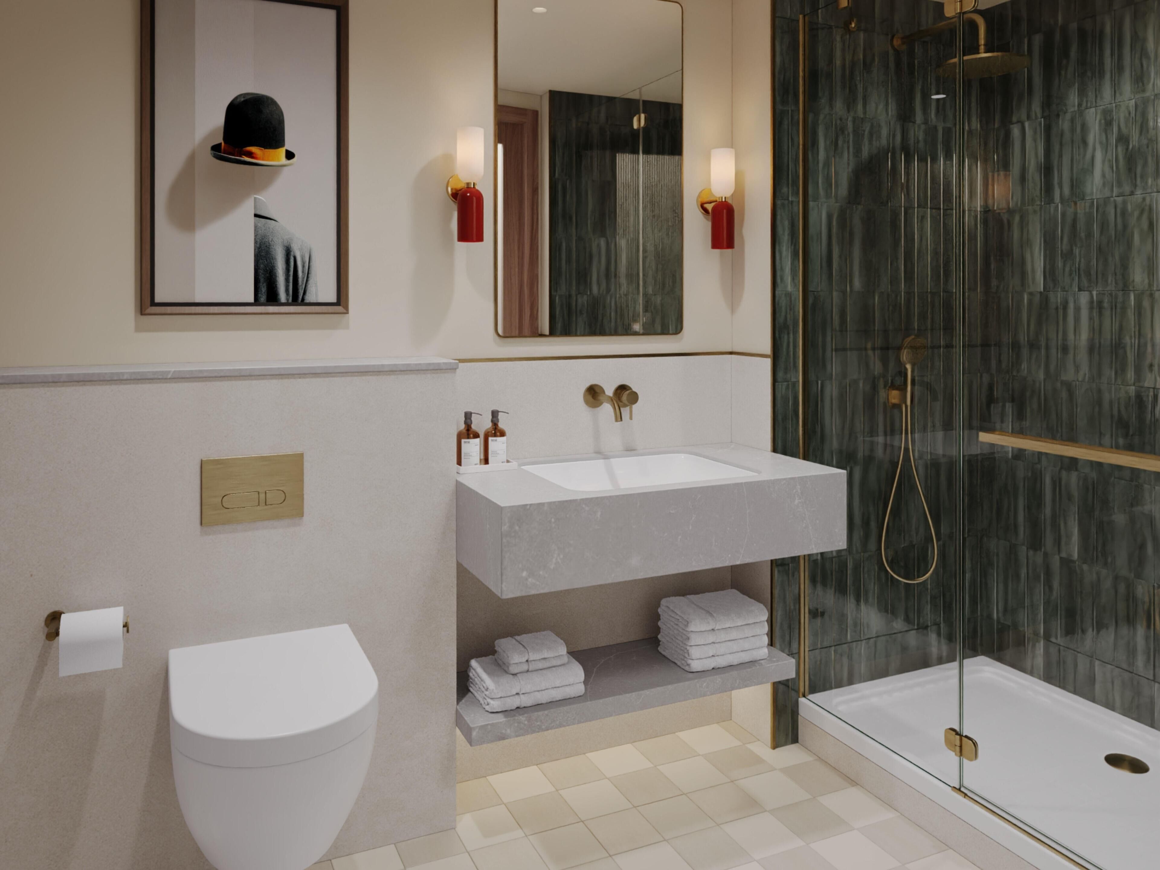 A modern bathroom with a white sink, a toilet, and a glass-enclosed shower.