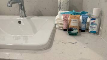 Hair dryer, towels, soap, toilet paper