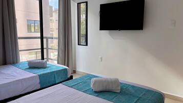 Desk, laptop workspace, blackout drapes, iron/ironing board