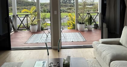 Riverfront Pet Friendly Minimalist Karaka Stay – Close to Motorway