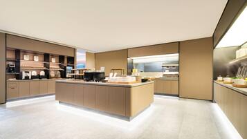 A modern kitchen with a central island, built-in appliances, and a sleek design.