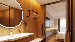 A modern hotel bathroom with wooden paneling, a large mirror, dual sinks, a bench, and a shower area. - Ji Hotel Guangzhou Sun Yat-sen University Metro (Guangzhou)
