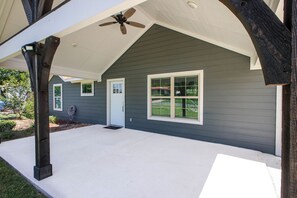 A house with a covered porch, a front door, and a large window. - 3BR Near Lackland AFB • Military & ALE Stays • W/D (San Antonio)
