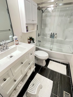 Shower, hair dryer, towels, soap