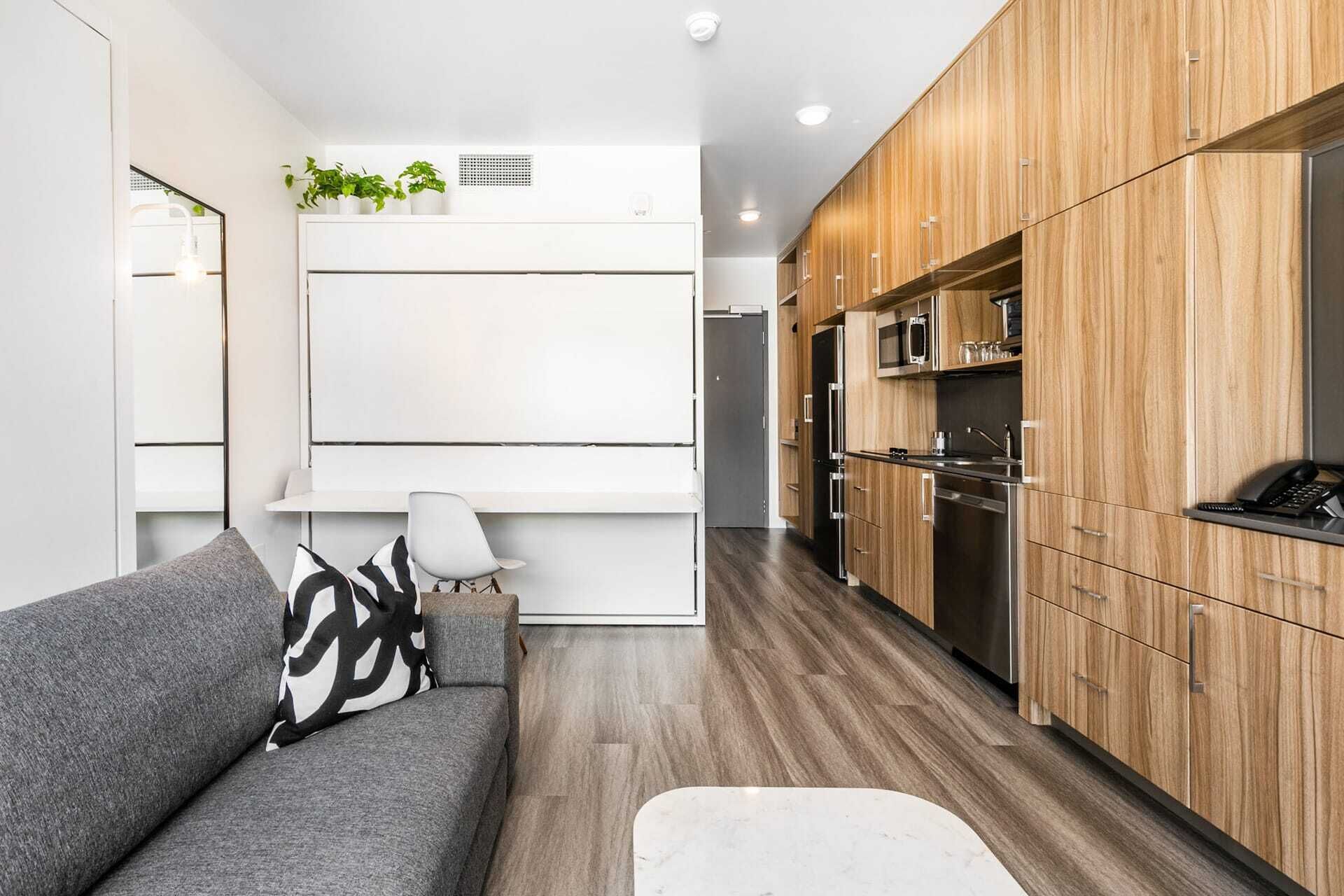 Efficient studio living with a full kitchen and lounge area
