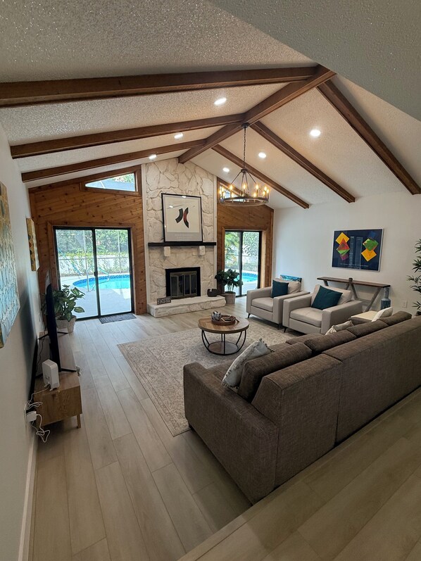 TV, fireplace - Gulfside Serenity Stay Spanish Oasis w/ Pool & Near the Beaches (Palm Harbor)