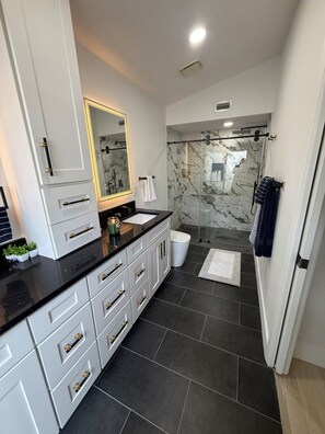 Shower, towels, soap, toilet paper