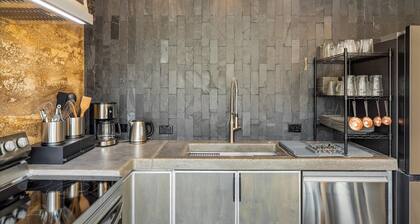 Earth-Built Cabin with Pine Shadows and a Tub That Waits
