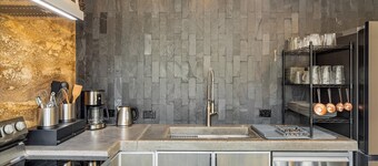 Earth-Built Cabin with Pine Shadows and a Tub That Waits