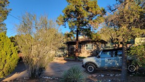 A house with a driveway leading to a parked car. - Vintage Charm, Modern Comfort & Private Casita. Near Downtown Prescott. (Prescott)