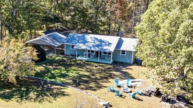 A house with a covered porch, a fenced yard, and outdoor seating. - Lookout Mtn. Escape w/ Fire Pit & 1 Acre Level Lawn- Mins to Cloudland Canyon (Rising Fawn)