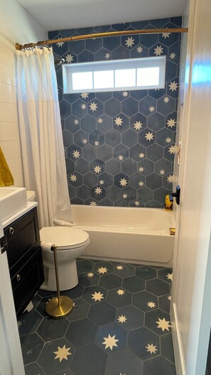 Shower, towels, soap, toilet paper