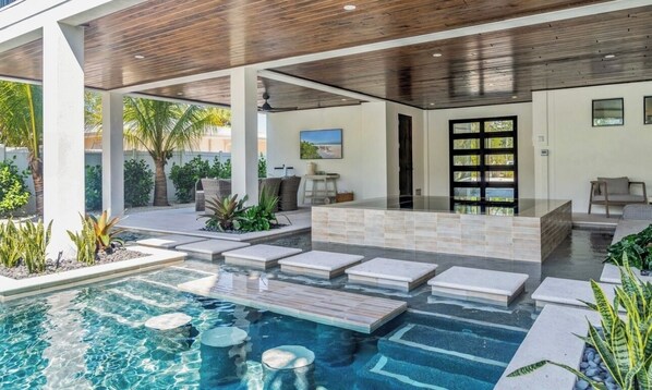Outdoor pool, a heated pool - Gorgeous canal front home on Anna Maria! (Anna Maria)