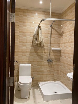 Shower, free toiletries, hair dryer, slippers