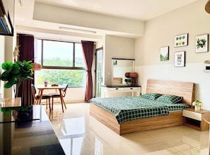Deluxe Apartment, 1 King Bed, City View | Living area | 45-inch LCD TV with cable channels