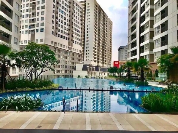 Outdoor pool, open 6:00 AM to 9:00 PM, pool umbrellas, pool loungers