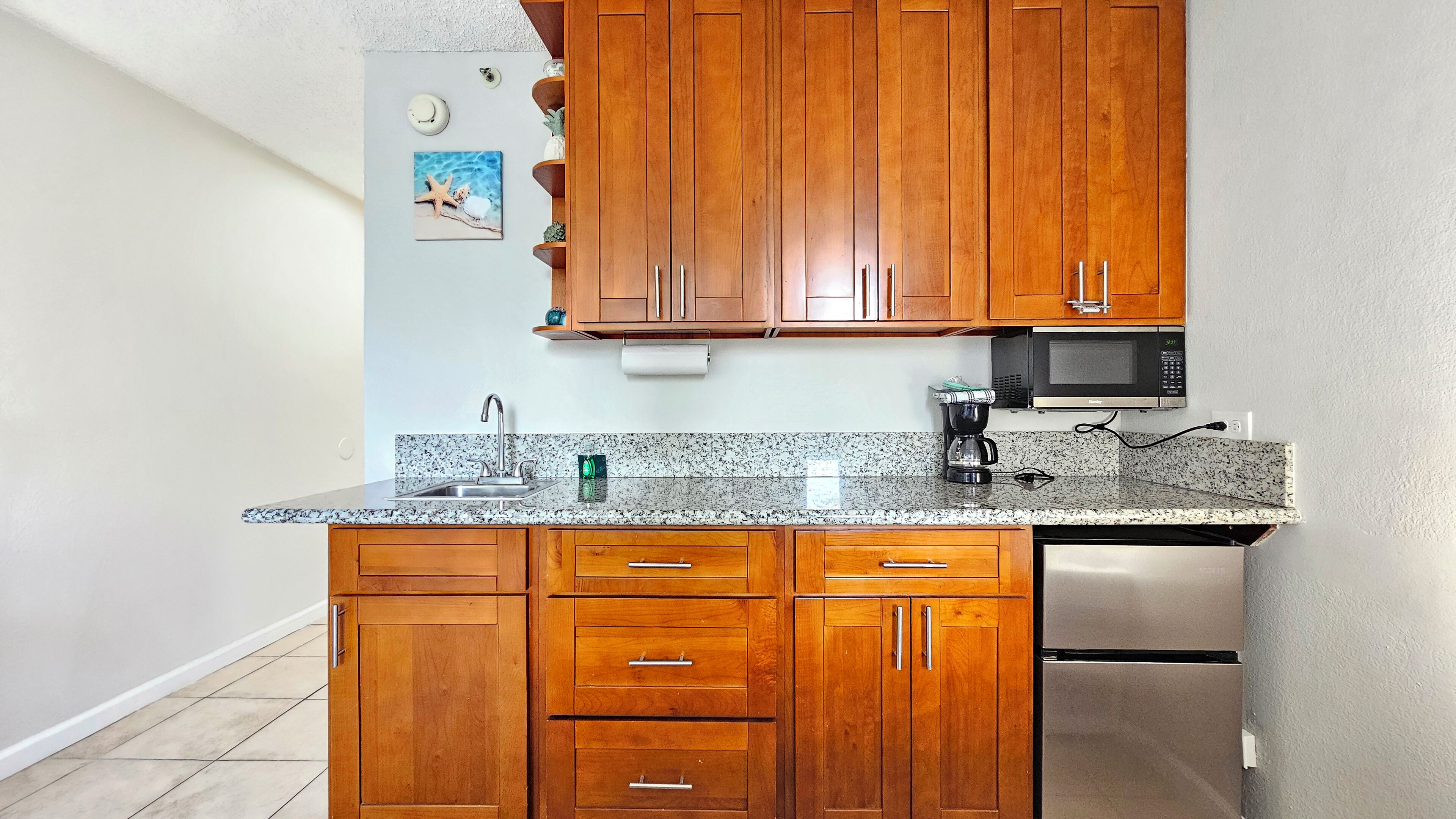 Fridge, microwave, stovetop, coffee/tea maker