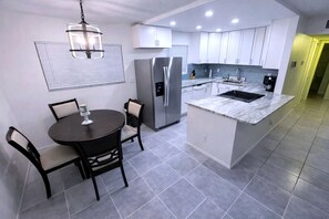 Coffee/tea maker, fridge, microwave, oven
