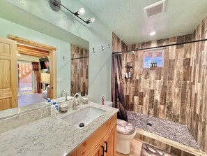 Shower, hair dryer, towels, shampoo