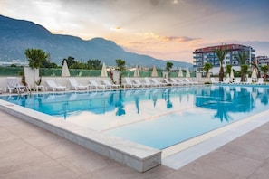 Indoor pool, pool umbrellas, pool loungers