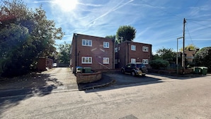 A two-story brick building with a sign reading "St. Margaret Court." - Homely flat in Surrey, Sleeps 3, family friendly (Walton-on-Thames)