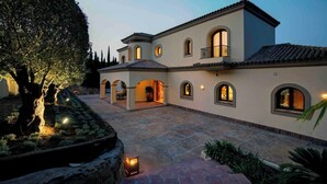 A large, multi-story building with arched windows and a courtyard. - 8 bedroom luxury villa + sea, golf course and mountain views (Sotogrande)