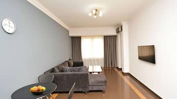 Comfort Apartment, Balcony, Garden View | Living area | 50-inch flat-screen TV with cable channels