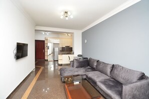 Comfort Apartment, Balcony, Garden View | Living area | 50-inch flat-screen TV with cable channels - Apartments by Luxe Group BU944 (Yerevan)