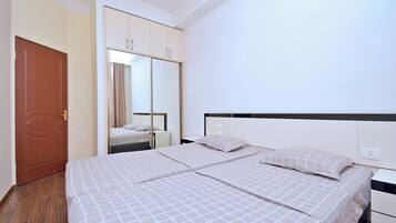 Premium bedding, laptop workspace, blackout curtains, iron/ironing board