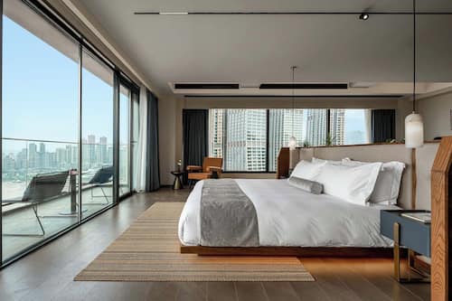 Luxury Suite, City View | Premium bedding, down comforters, minibar, individually decorated
