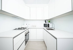 Coffee/tea maker, fridge, microwave, oven