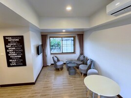 Family Suite, Balcony, City View | In-room dining