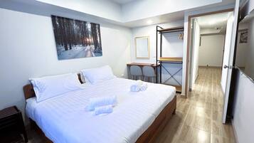 Deluxe Double Room, Balcony, City View | In-room safe, desk, laptop workspace, blackout drapes