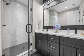 Shower, hair dryer, towels, shampoo