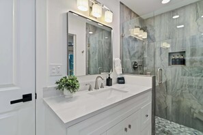 Shower, hair dryer, towels, shampoo