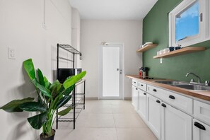 Fridge, microwave, stovetop, coffee/tea maker