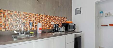 Fridge, microwave, stovetop, coffee/tea maker