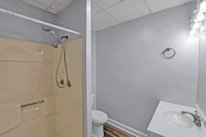 Shower, hair dryer, towels, shampoo