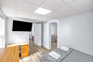 1 bedroom, desk, iron/ironing board, travel crib