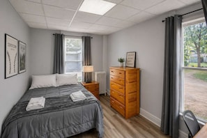 1 bedroom, desk, iron/ironing board, travel crib