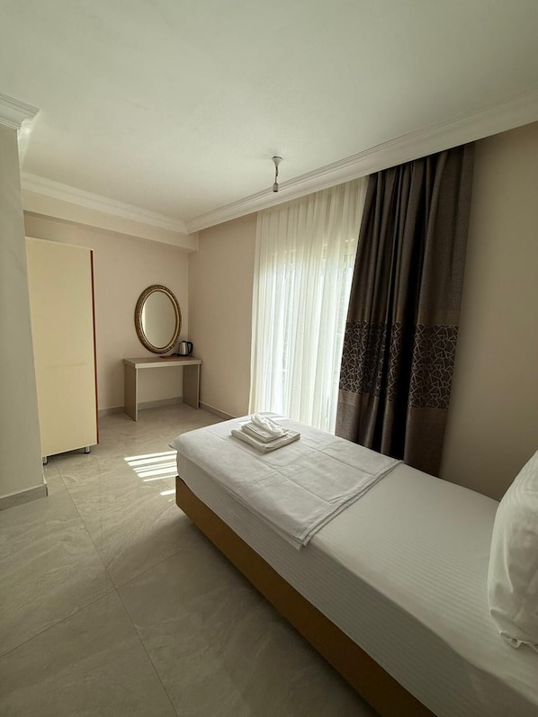 Standard Triple Room, Balcony | Laptop workspace, free WiFi